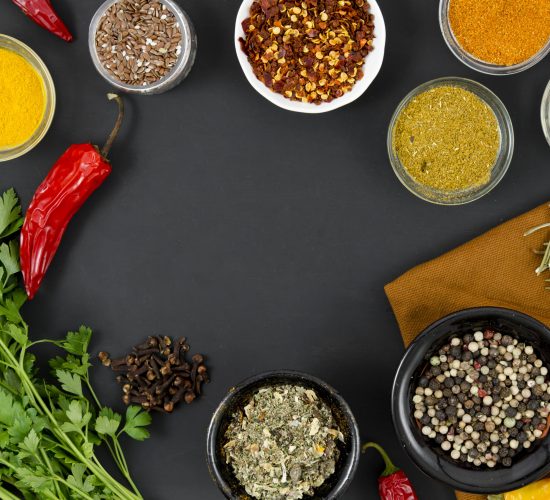 group-bowls-full-spices-black-background